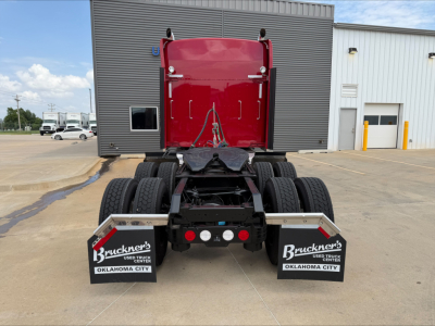 Kenworth W900L tractor rear view showing dual rear axles and mudflaps with Bruckner's Oklahoma City branding.