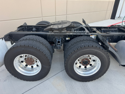 Kenworth T680 chassis with dual rear axles and wheels, showing underframe and fifth-wheel housing.