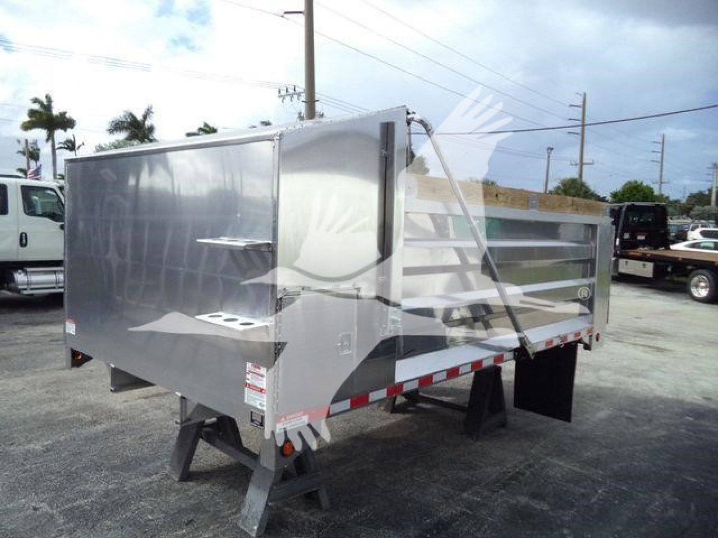 Dump trailer showing aluminum 14 ft bed with side rails and rear ramp gate, stock number ADFAB14FTALUM1, new condition.