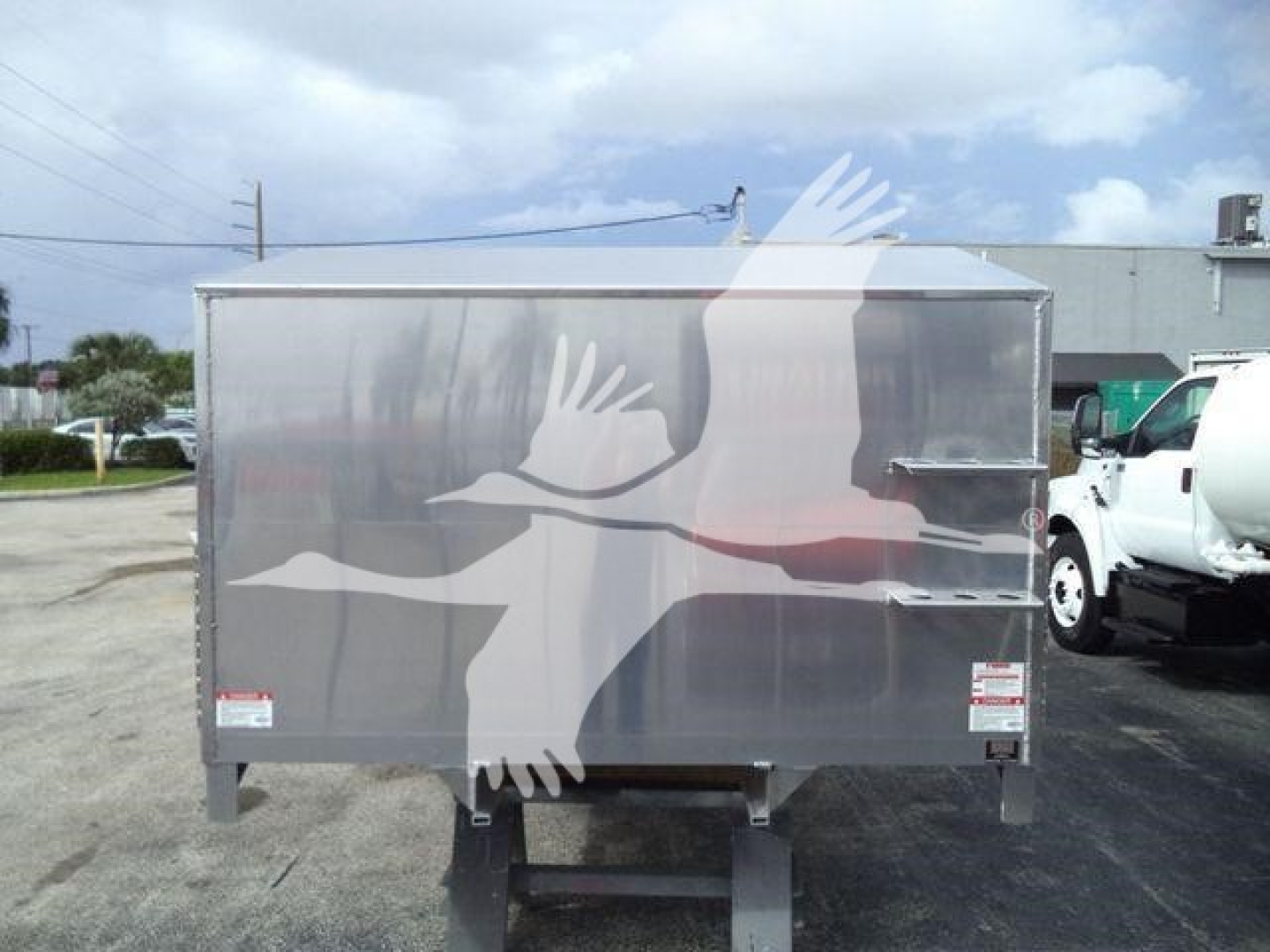 Aluminum 14 ft dump trailer by Advanced Fabricators, stock number ADFAB14FTALUM1, side view showing reflective panel with hinged door and support legs.