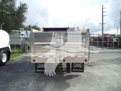 Dump truck bed with aluminum panels and rear doors, stock number ADFAB14FTALUM1 visible in listing context.