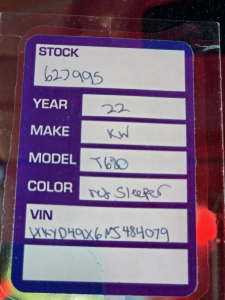 Stock tag with handwritten details: YEAR 22, MAKE KW, MODEL T680, COLOR ? Sleeper, VIN 1XKYD49X6NJ484079.