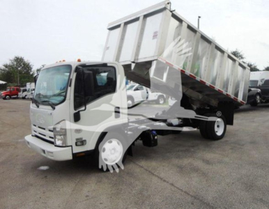 Isuzu NQR dump truck with raised bed in a dealership lot showing cargo bed and front cab.
