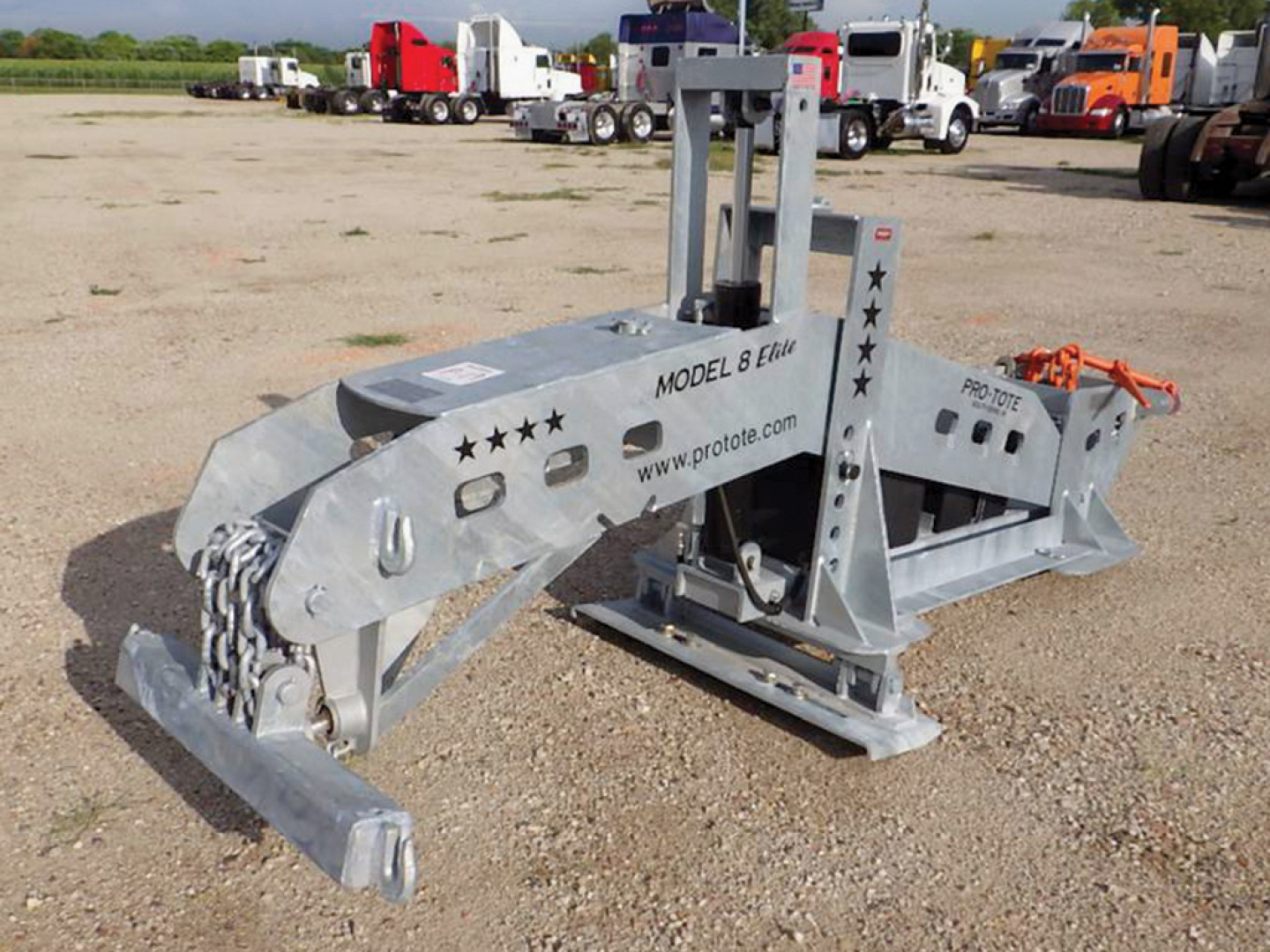 Pro-Tote 8 Elite hydraulic fifth wheel wrecker on a gravel lot with other trucks in background.