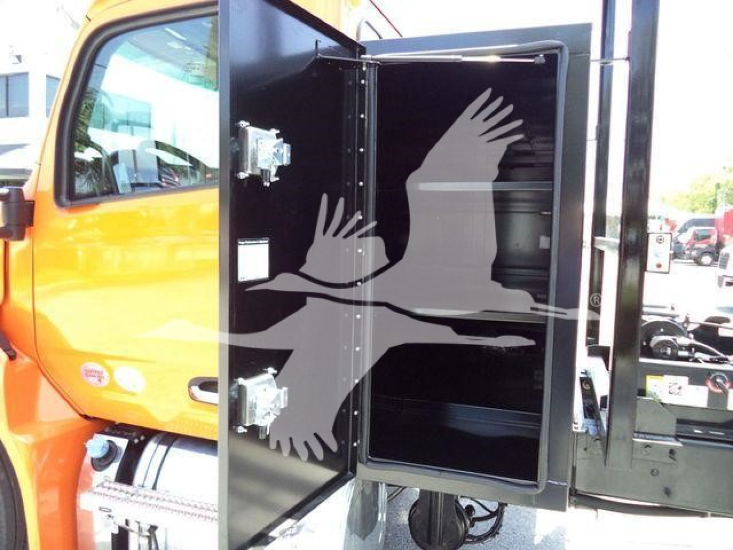 Peterbilt 536 cab with open rear compartment showing interior space and black interior panels.