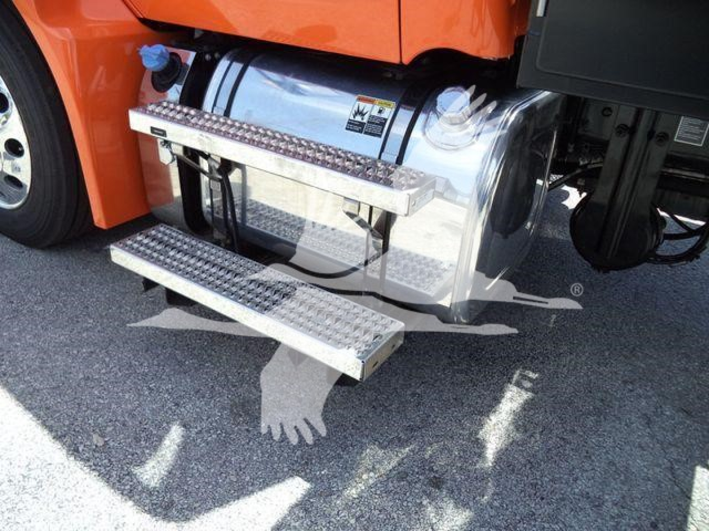 Peterbilt 536 fuel tank and chrome side steps near the cab.