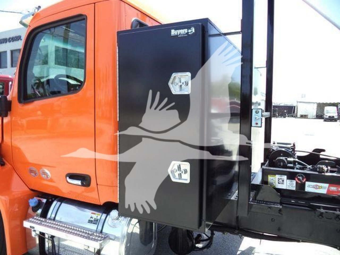 Peterbilt 536 cab area with side-mounted toolbox showing two latching doors and a portion of the chassis.