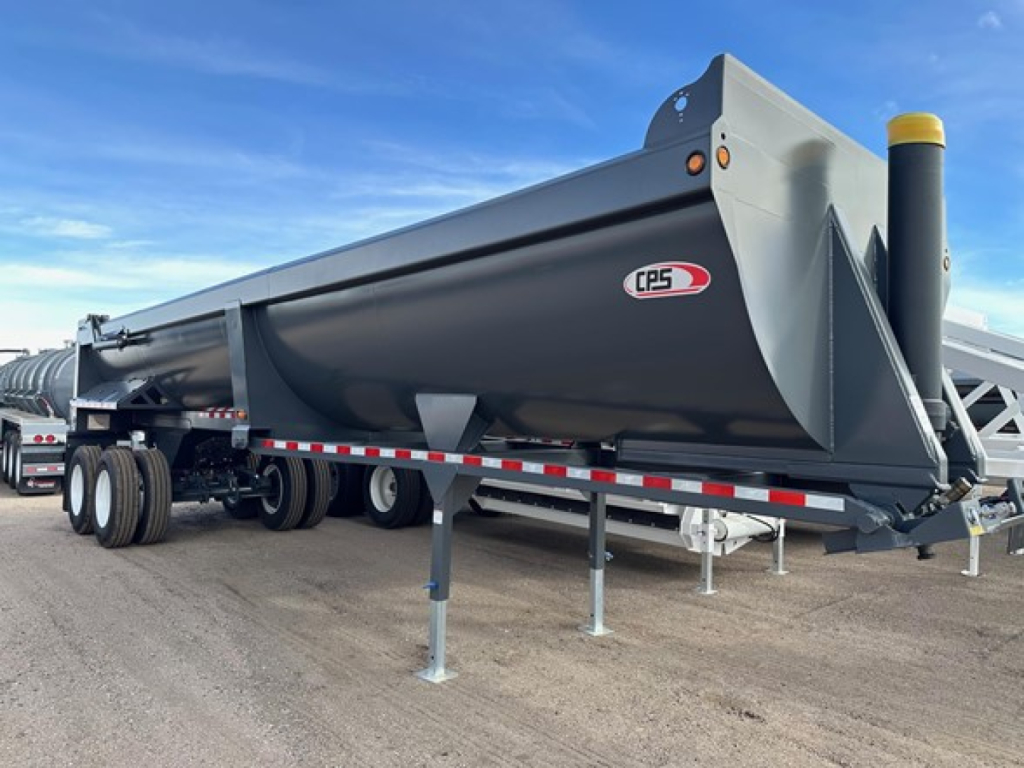 CPS 34' frameless rock end dump trailer with high lift gate, black body, dual rear axles and landing gear visible.