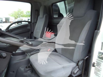 Isuzu NPR truck cabin interior with two front seats and steering wheel, text visible on seat fabric and side panel