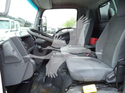 Isuzu NPR cab interior showing driver's seat and passenger seat, steering wheel, dashboard, and center console in a used truck.