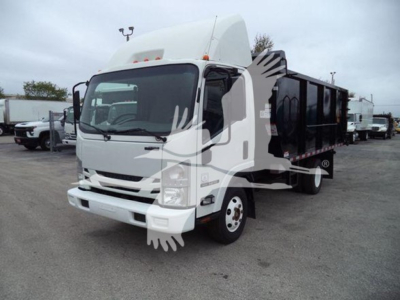 Isuzu NPR dump truck in-service showing cab front and dump bed with white cab and black bed side panels.