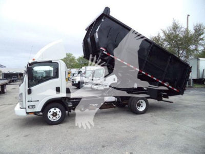 Isuzu NPR dump truck with raised black dump body in service position, white cab, side view showing hydraulic lift and cargo bed outline.