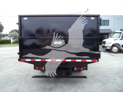 Dump truck bed rear view with black hopper, white and gray eagle graphic, rear lights, and bumper; no legible text visible on the image itself.