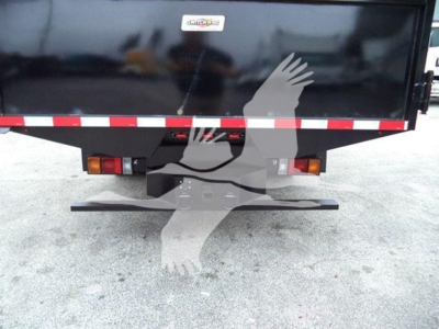 Isuzu NPR dump truck tail showing bumper, hitch, taillights, and reflective red/white safety tape.