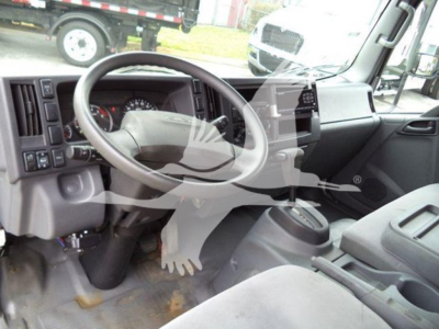 Isuzu NPR cab interior showing steering wheel and dashboard view.