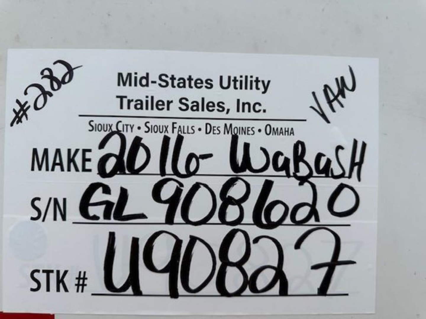 Trailer tag from Mid-States Utility Trailer Sales showing handwritten VIN, stock number, and make: 2016 Wabash van.