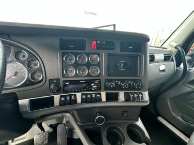 Kenworth T880 dash and instrument cluster showing gauges and controls in cab view.