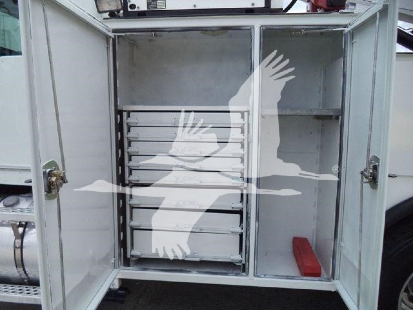 Kenworth T270 service truck rear cargo area with metal drawers and storage compartments visible.