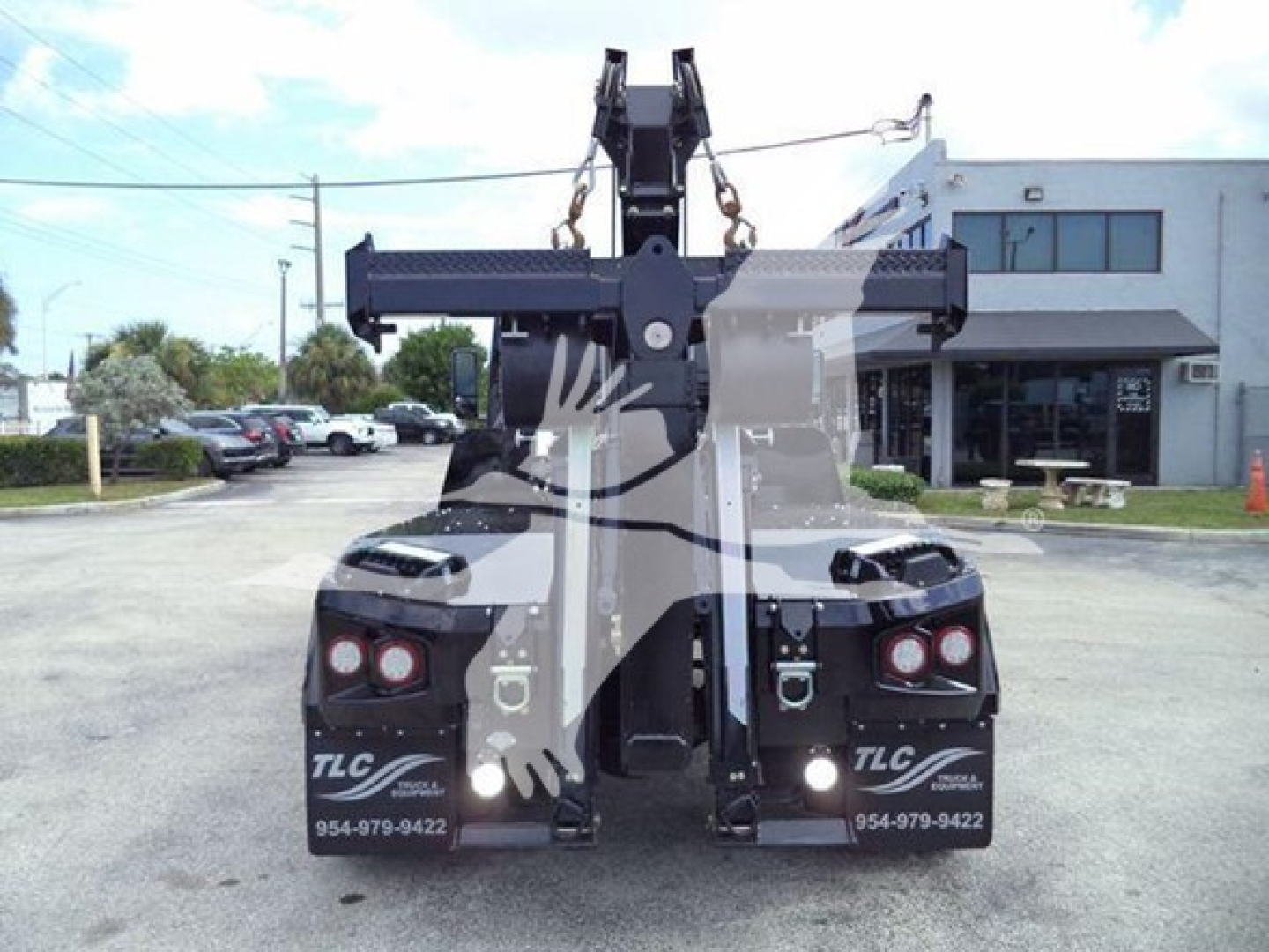 Truck with a winch hitch assembly rear view and tow hooks, International MV truck, stock J78070, VIN 3HAEUMMLXSL178070.