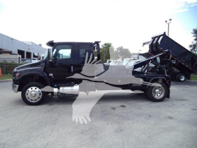 Fleet-ready 2025 International MV dump truck with winch, side view showing dual rear wheels and dumping bed.