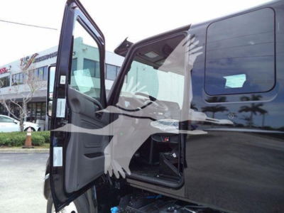 International MV truck door open showing cabin interior and windshield, with VIN and stock not visible on image.