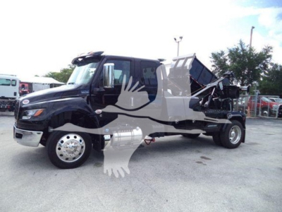 2005 International MV truck with dump bed in service bay. VIN 3HAEUMMLXSL178070 visible near cab area.