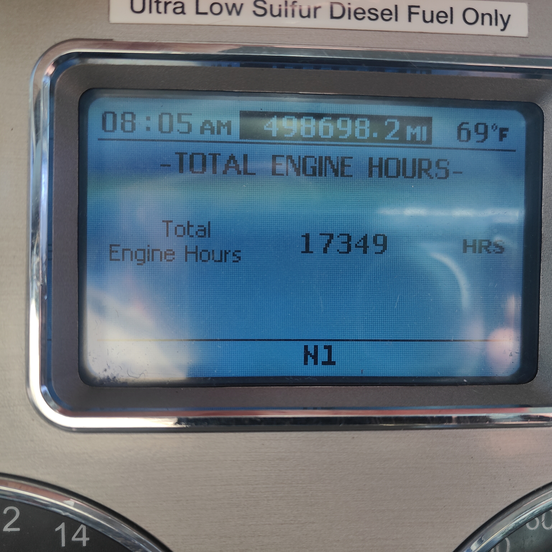 Dashboard display showing Total Engine Hours 17349, time 08:05 AM, 69°F, miles 498,698.2, N1 label, Ultra Low Sulfur Diesel label above.