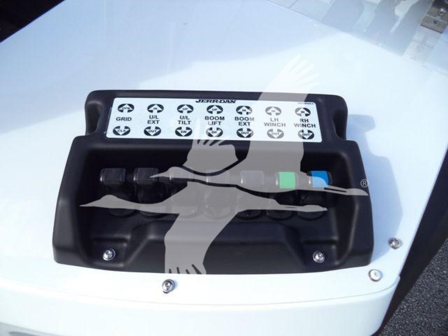 Winch control panel on Silverado 6500HD showing labeled selectors and two connectors with black and blue/green caps.