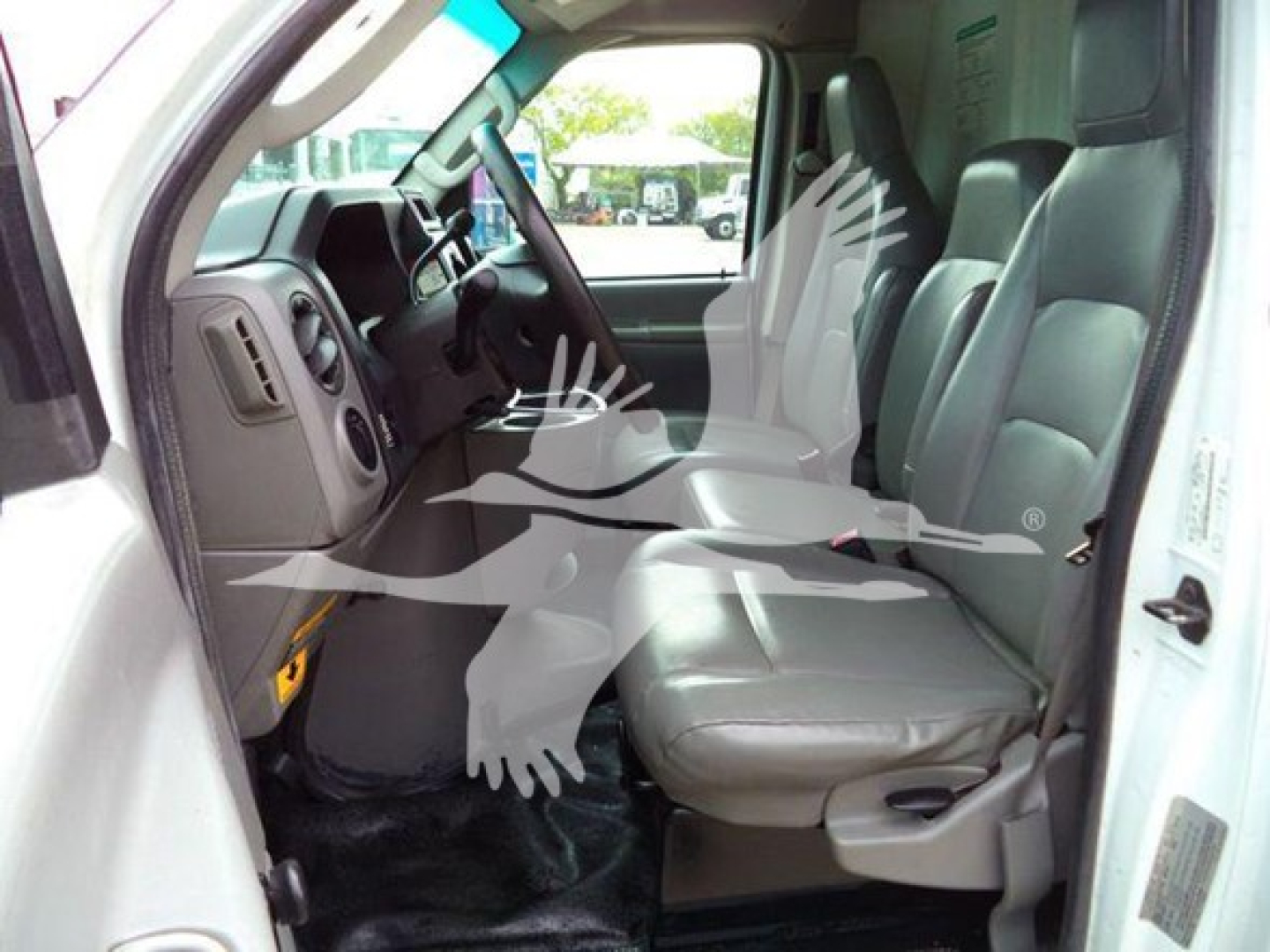 Ford E-Series van cab interior with front seats and dashboard visible; VIN and stock not shown in image; no detailed spec read.