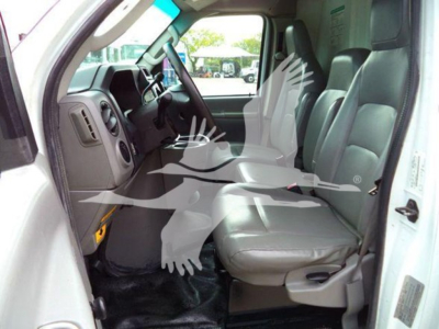 Ford E-Series van cab interior with front seats and dashboard visible; VIN and stock not shown in image; no detailed spec read.