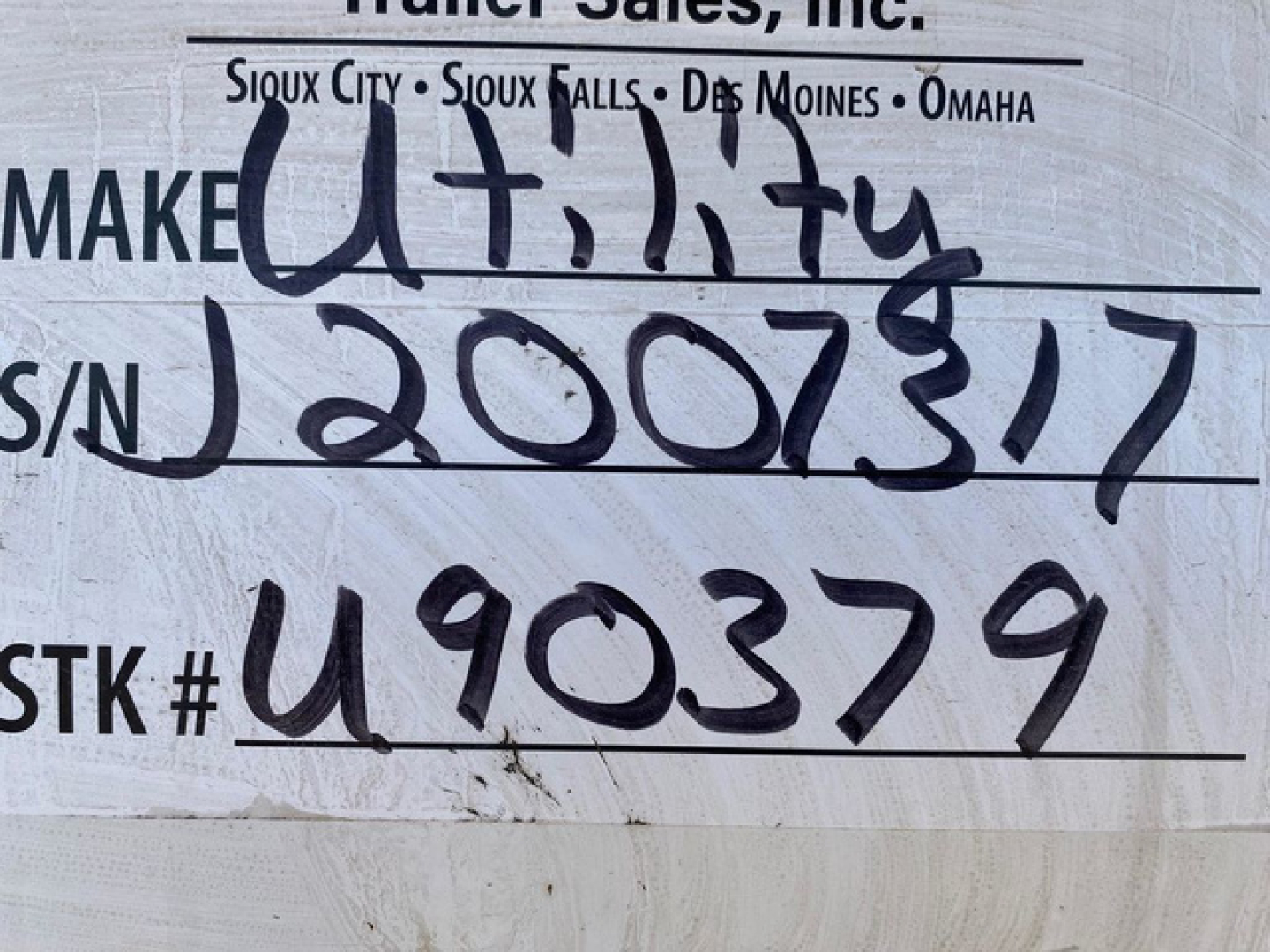 Trailer label showing stock number U90379 and S/N 2007317 handwritten, with Make Utity and various city names; 2018 Utility Reefer trailer in-service.