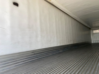 Trailer interior with ribbed floor and white walls showing cargo area in a 2018 Utility Reefer trailer.