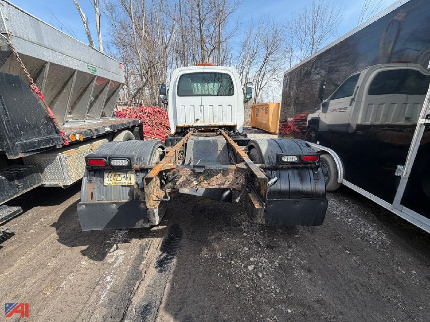 Chevrolet Kodiak C6500 cab and chassis rear view showing frame, fifth wheel area, dual rear tires, and diesel fuel tanks.