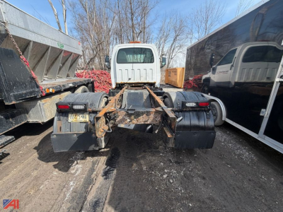 Chevrolet Kodiak C6500 cab and chassis rear view showing frame, fifth wheel area, dual rear tires, and diesel fuel tanks.