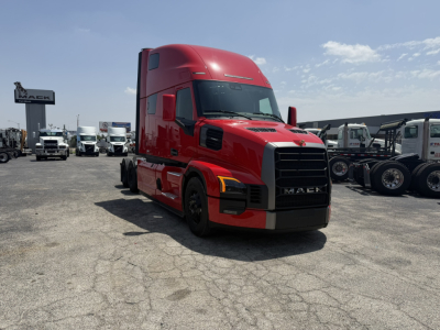 Mack PR64T76H conventional sleeper truck in red, front-left view.