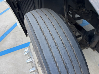 Volvo VNL780 truck front wheel and tire tread visible in engine bay area; no other components labeled.