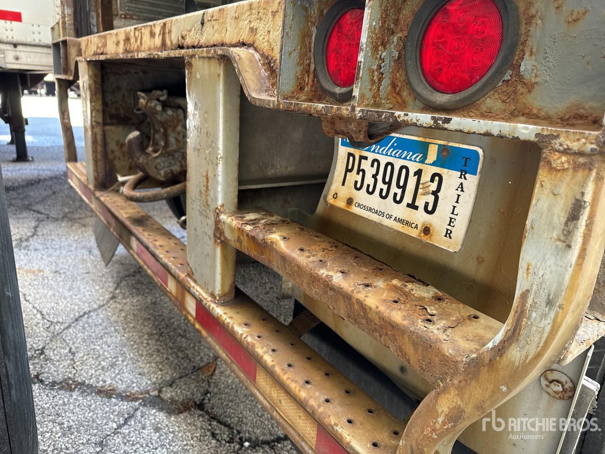 Trailer rear showing Indiana dealer plate P539913, rusted hitch frame, twin red taillights, and metal bumper with perforated step.