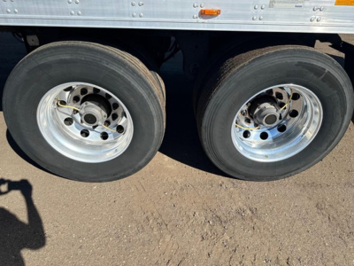 Trailer wheel pair for a 2019 Utility 3000R reefer trailer showing dual rear axles with polished aluminum rims and black tires.