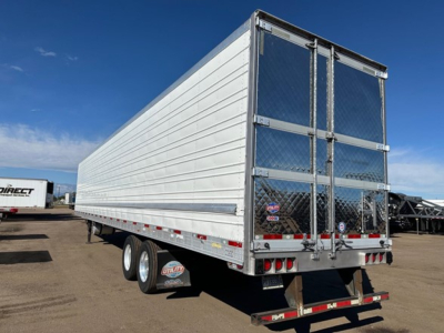 Utility 3000R reefer trailer showing rear doors and reflective diamond plate with bumper and dual axles.