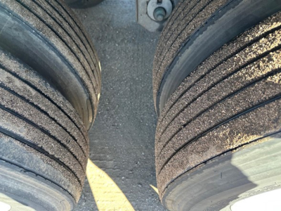 Trailer tires with tread and wear showing dual axles from a 2019 Utility 3000R trailer undercarriage.