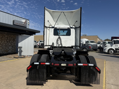 Truck rear view showing fifth wheel and dual wheel dual-axle setup of a 2022 Mack AN42T conventional daycab with white cab and trailer hitch area visible.
