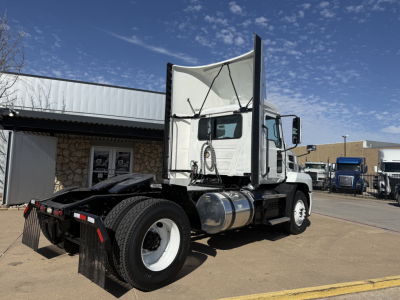 Truck image showing a white 2022 Mack AN42T daycab 4x2 tractor with fuel tanks, rear fenders, and open hood area. Side view of cab and rear wheels visible.