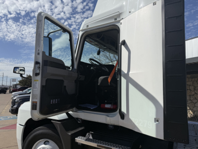Truck cab interior and door open showing Mack AN42T features and step access with VIN plate not visible.
