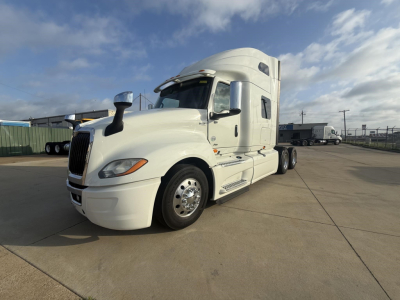 White 2020 International LT conventional sleeper truck exterior side view showing aerodynamic cab and dual rear axles.