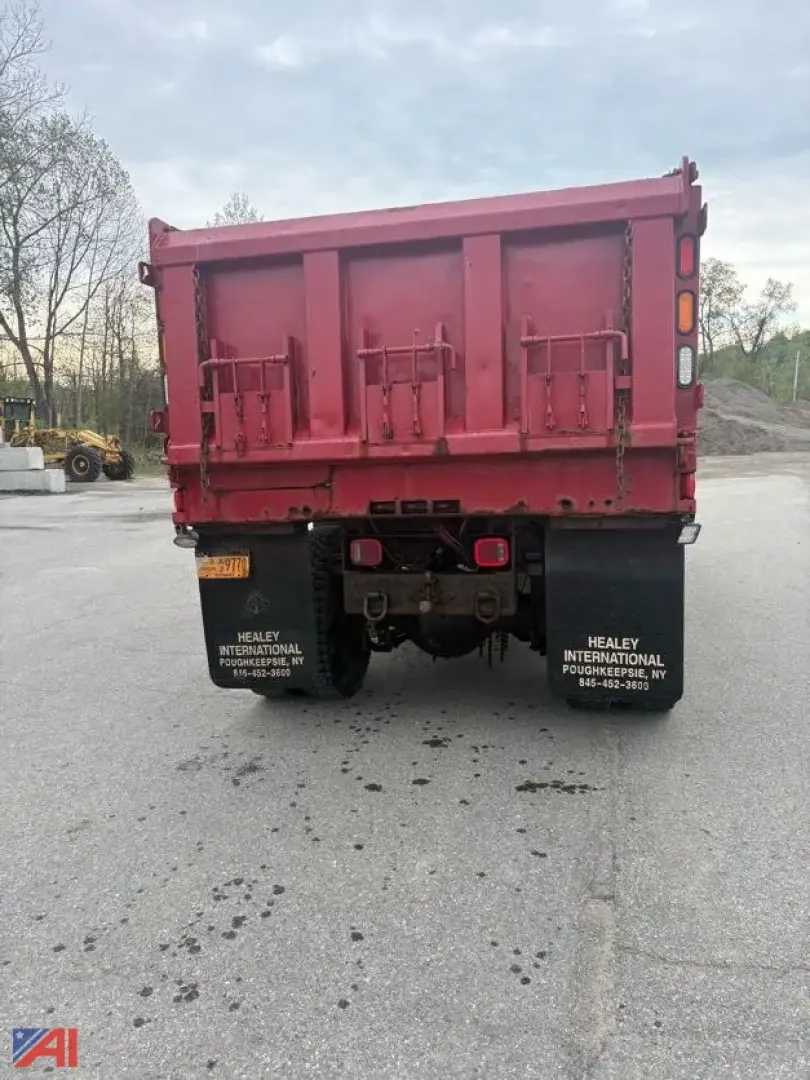 Dump truck rear showing plow wing and sander equipment on a red 2007 International WorkStar 7500 with Heilay branding on mud flaps.