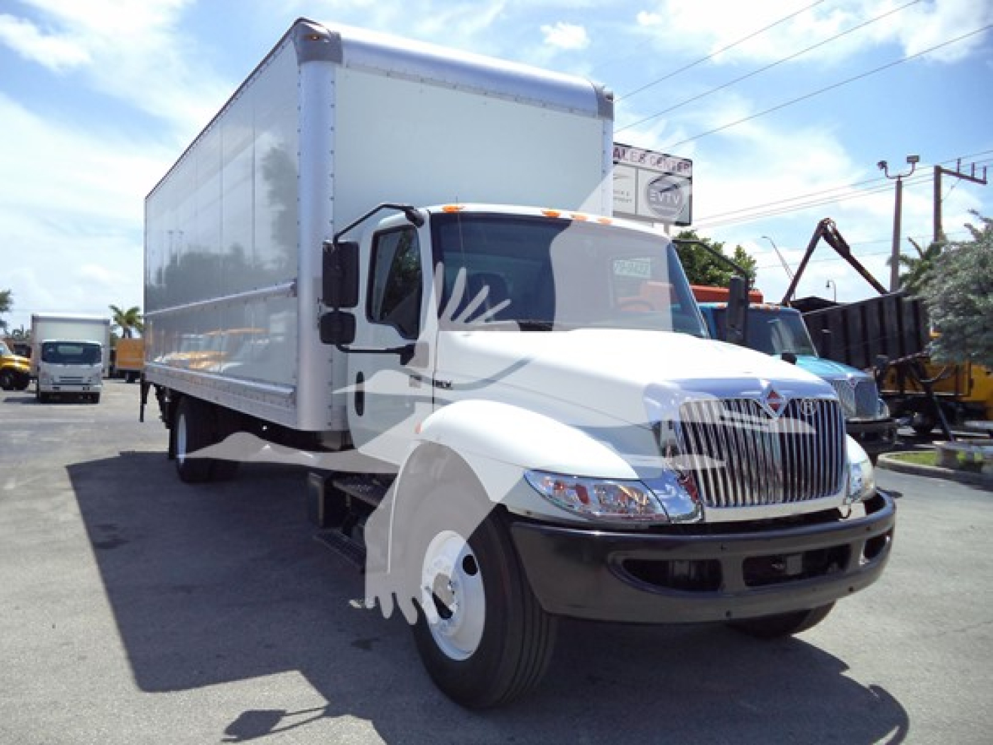 Box truck showing 2021 International MV with a large white cargo box and cab, VIN 3HAEUMMLXML683478 visible in listing, stock T83478, used condition.