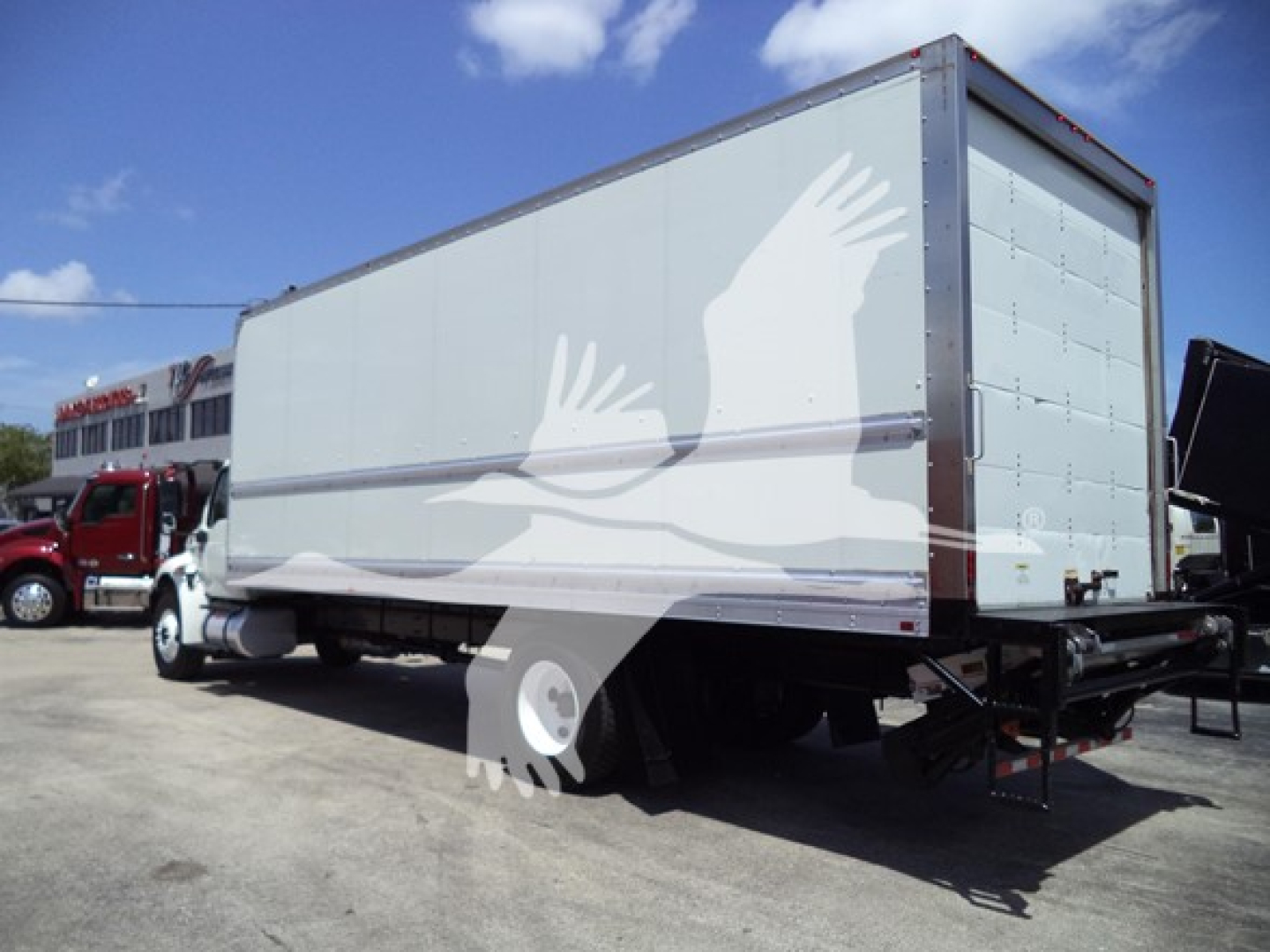 Truck box truck rear and side view showing enclosed cargo box on International MV chassis