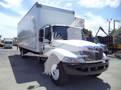 Box truck showing 2021 International MV with a large white cargo box and cab, VIN 3HAEUMMLXML683478 visible in listing, stock T83478, used condition.