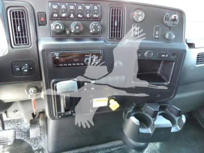 Dashboard of 2021 International MV box truck showing controls, vents, cup holders, and ignition area.