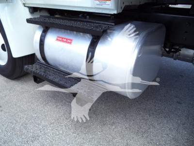 Truck fuel tank with side steps attached under the cab and a 'SEAL-ONE' label visible on the tank.